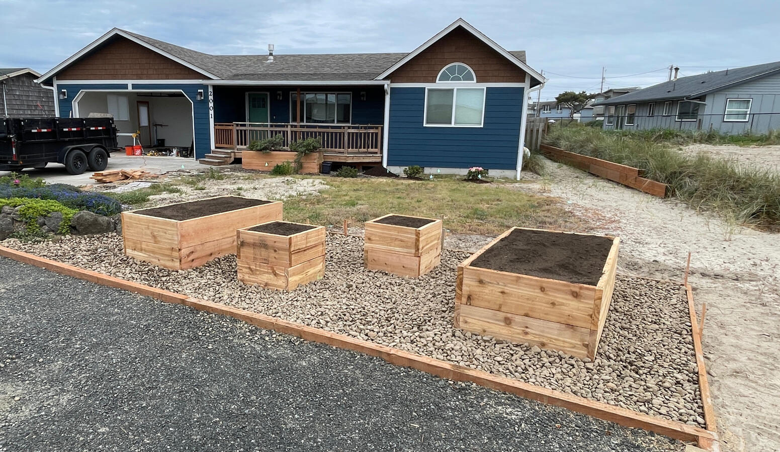 Created parking area and built planter boxes Created parking area and built planter boxes